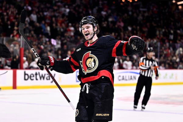 FILE - Ottawa Senators' Josh Norris (9) celebrates a goal by Shane Pinto (12), not shown, during second period NHL hockey action against the Washington Capitals in Ottawa, on Thursday, Jan. 30, 2025. (Justin Tang/The Canadian Press via AP, File)