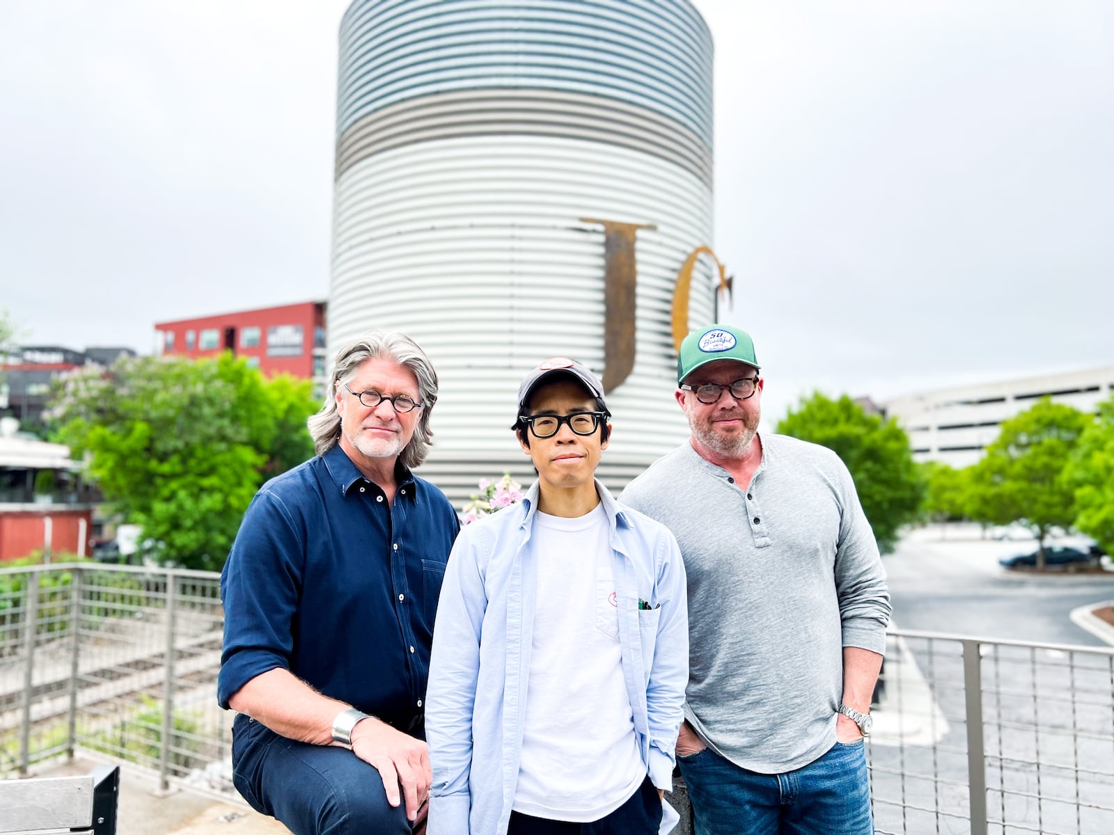 Designer Smith Hanes (from left), Alvin Diec, brand manager for Rocket Farm Restaurants and Ford Fry in front of the former JCT Kitchen space.