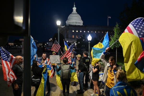 Supporters of Ukraine demonstrated outside the U.S. Capitol in Washington on Tuesday. The Senate passed a $95.3 billion package of aid to Ukraine, Israel and Taiwan. 