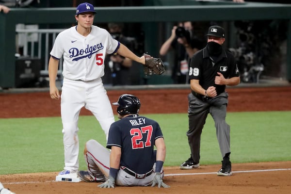 Braves third baseman Austin Riley (27) is out at third base after the tag by Los Angeles Dodgers shortstop Corey Seager following a rundown during the fourth inning  Sunday, Oct. 18, 2020, in Game 7 of the National League Championship Series at Globe Life Field in Arlington, Texas. (Curtis Compton / Curtis.Compton@ajc.com)