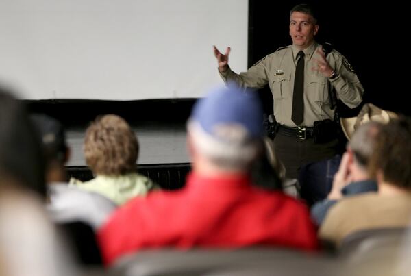 Cherokee County Sheriff’s Department Chief Deputy Joe Perkins leads an active shooter seminar the evening of January, 12, 2016, at Etowah High School in Woodstock. (Ben Gray / bgray@ajc.com)