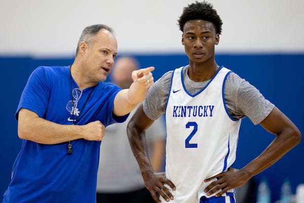 Kentucky assistant coach Mark Fox assists Wildcats guard Jaxson Robinson at a practice. The former Georgia coach has returned to the bench to help coach Mark Pope, whom Fox once coached and later employed at Georgia. (Photo by Chet White/UK Athletics)