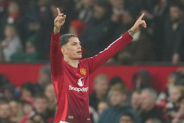 Manchester United's Alejandro Garnacho celebrates after scoring his side's third goal during the English Premier League soccer match between Manchester United and Leicester City, at the Old Trafford stadium in Manchester, England, Sunday, Nov.10, 2024. (AP Photo/Jon Super)