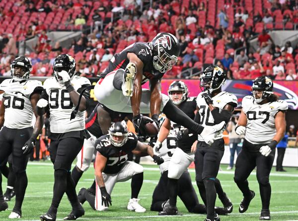 August 2 , 2022 Atlanta - Atlanta Falcons' running back Caleb Huntley (42) celebrates after scoring a touchdown during the second half of the final exhibition game of the preseason at Mercedes-Benz Stadium in Atlanta at on Saturday, August 27, 2022. Atlanta Falcons won 28-12 over Jacksonville Jaguars. (Hyosub Shin / Hyosub.Shin@ajc.com)