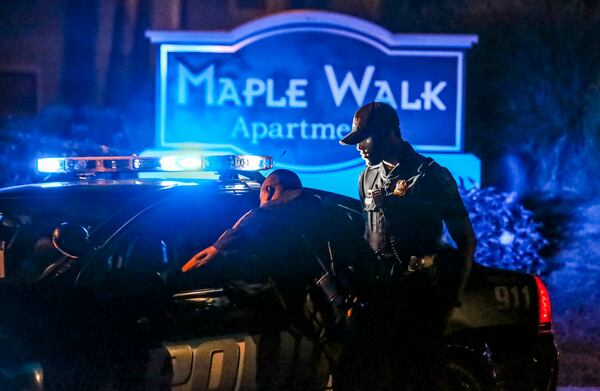 The scene at the Maple Walk Apartments early Thursday morning, Aug. 3, 2017. Quintas “Shun” Harris was shot multiple times in a gun battle with DeKalb County police officers.