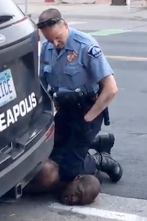 In this Monday frame from video provided by Darnella Frazier, a Minneapolis officer kneels on the neck of a handcuffed man who was pleading that he could not breathe in Minneapolis. Four Minneapolis officers involved in the arrest of  George Floyd, who died in police custody, were fired Tuesday.