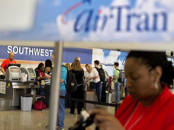 Southwest Airlines bought AirTran Airways in 2011 for $1.4 billion and announced plans to combine the fleets under the Southwest brand. Associated Press File