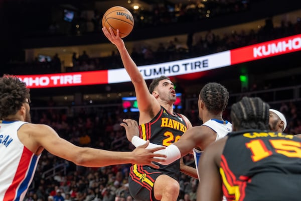 Atlanta Hawks forward Georges Niang (20) attempts a basket during the first half of an NBA basketball game against the Detroit Pistons, Sunday, Feb. 23, 2025, in Atlanta. (AP Photo/Erik Rank)