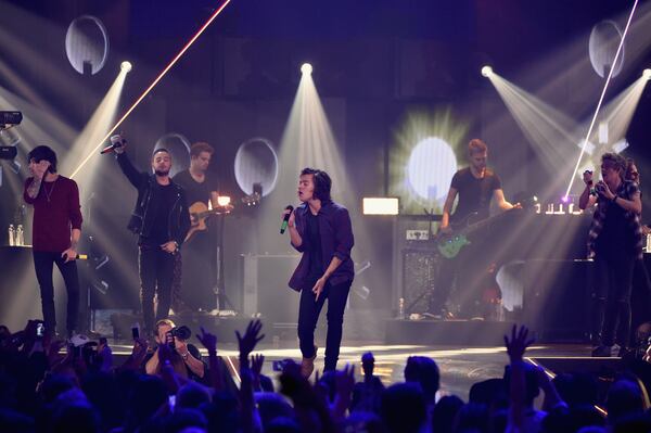 LAS VEGAS, NV - SEPTEMBER 20: (L-R) Musicians Zayn Malik, Liam Payne, Harry Styles and Niall Horan of One Direction perform onstage during the 2014 iHeartRadio Music Festival at the MGM Grand Garden Arena on September 20, 2014 in Las Vegas, Nevada. (Photo by Ethan Miller/Getty Images for Clear Channel) One Direction, shown at the iHeartRadio Music Festival in Las Vegas Sept. 20, hit the Georgia Dome on Wednesday with 5 Seconds of Summer. Photo: Getty Images