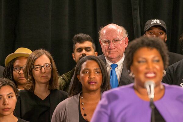 Stacey Abrams' campaign manager, Lauren Groh-Wargo, shown at left watching the candidate speak, has a message for state Democrats who may be giddy over their victories here in the presidential race in 2020 and the U.S. Senate runoffs in 2021: “We cannot underestimate Brian Kemp.” (ALYSSA POINTER/ALYSSA.POINTER@AJC.COM)