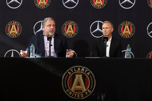 Chris Henderson (right), the newly appointed chief soccer officer and sporting director of Atlanta United, and Garth Lagerwey (left), president and chief executive officer of Atlanta United, speak during a press conference introducing Henderson as the new technical director on Tuesday, December 17, 2024, at the Atlanta United training grounds in Marietta, Georgia. CHRISTINA MATACOTTA FOR THE ATLANTA-JOURNAL CONSTITUTION.


