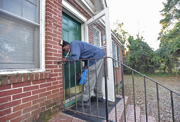 Byron Ferguson arrives at his home in Columbus. Ferguson fought to be allowed to go to a transitional center to prepare to leave prison after a lifetime of prison stints and failed efforts to turn his life around. HYOSUB SHIN / HSHIN@AJC.COM