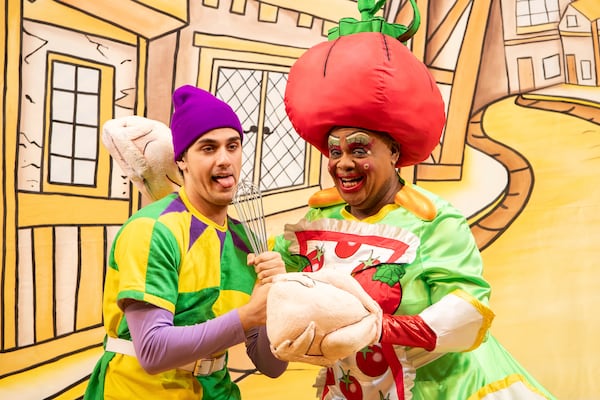 Olivier Award-winner Clive Rowe (right) performs as Dame Sarah the Cook during a photocall for Hackney Empire's Dick Whittington and His Cat in London, Tuesday, Dec. 3, 2024. (AP Photo/Thomas Krych)