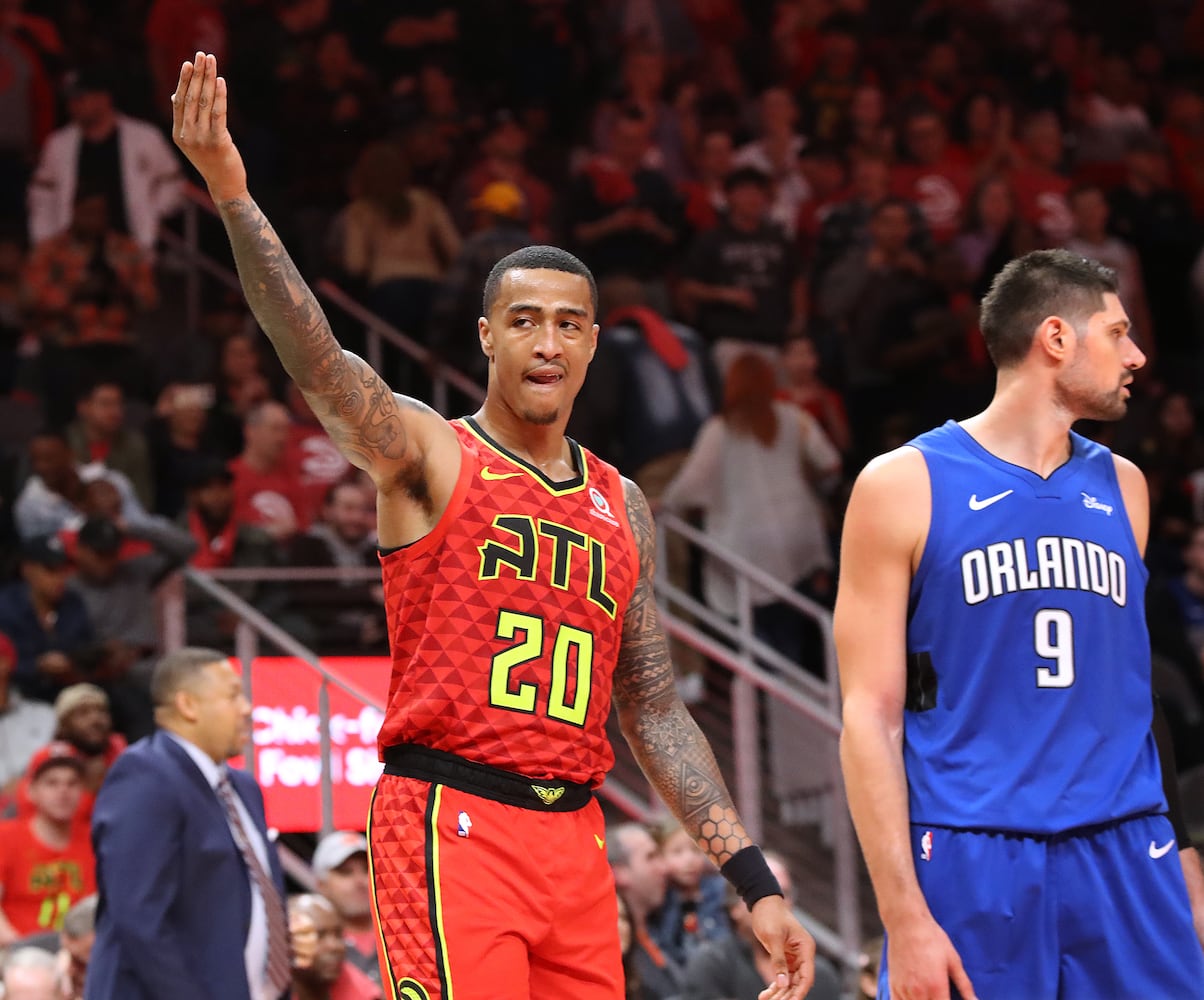 Photos: Hawks edge Magic in home opener