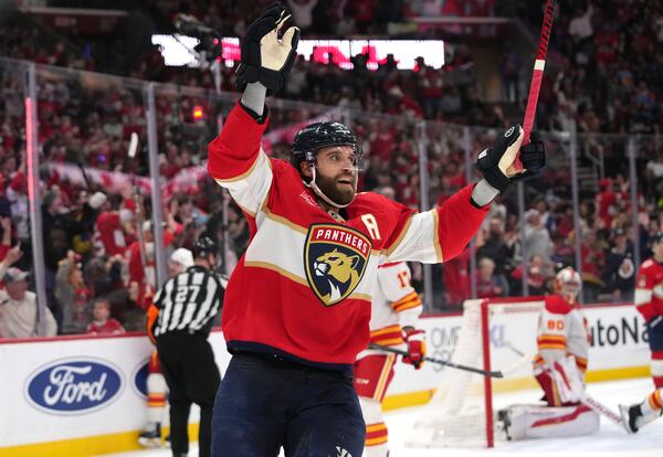 Florida Panthers defenseman Aaron Ekblad reacts after assisting on a goal scored by Evan Rodrigues during the second period of an NHL hockey game against the Calgary Flames, Saturday, March 1, 2025, in Sunrise, Fla. (AP Photo/Lynne Sladky)