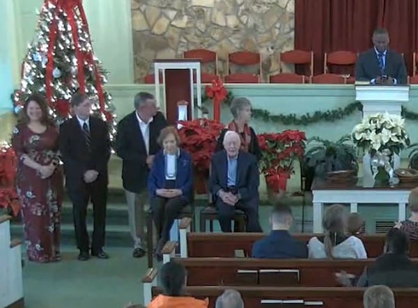 Former President Jimmy Carter and first lady Rosalynn Carter are seated at left in front of the congregation for a moment during the morning service at Maranatha Baptist Church in Plains on Sunday, December 29, 2019. (Photo from Maranatha Baptist livestream)