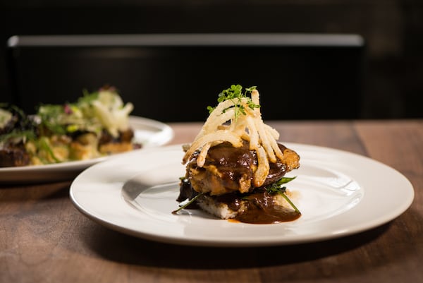  Rose + Rye Chicken Mole with Braised chicken thigh, crispy rice cake, and wilted kale. / Photo credit- Mia Yakel.