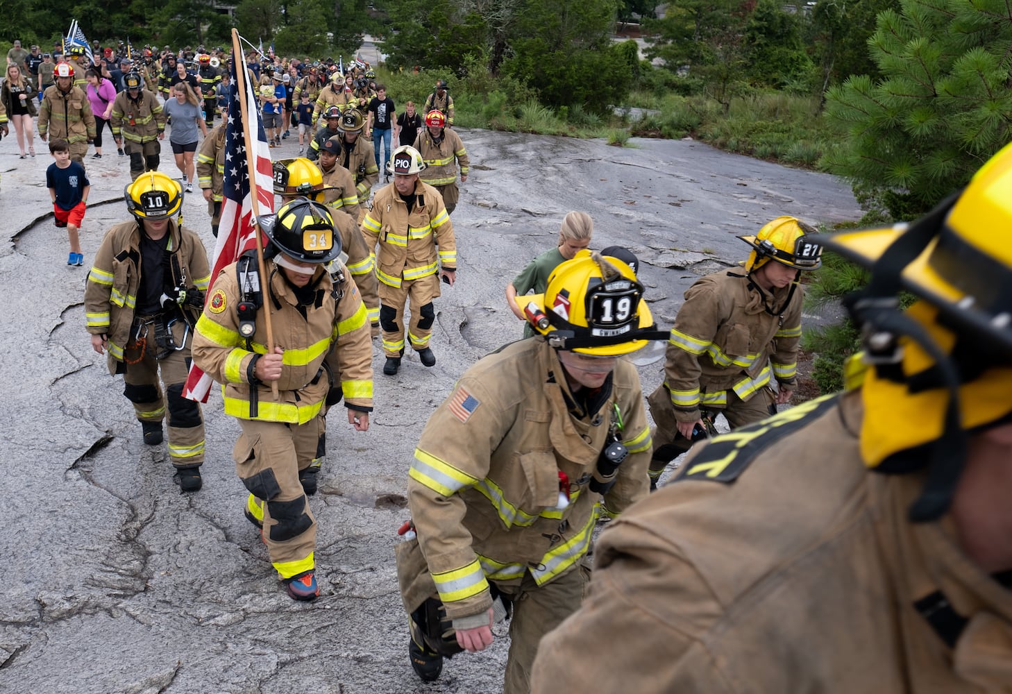 Firefighters climb Stone Mountain on Sunday morning, Sept. 11, 2022, during the annual remembrance of the 9/11 terrorist attacks. (Photo: Ben Gray for The Atlanta Journal-Constitution)