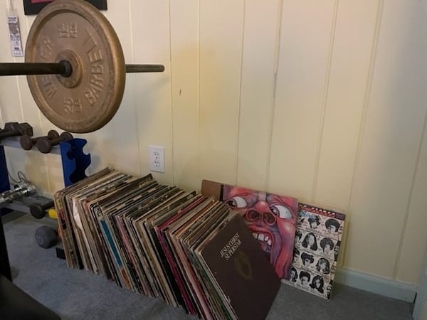 The record collection, largely unplayed for years, has ended up in the basement, the last stop before the used record shop. The King Crimson album, in back, seemingly doesn't like the idea. Photo by Bill Torpy