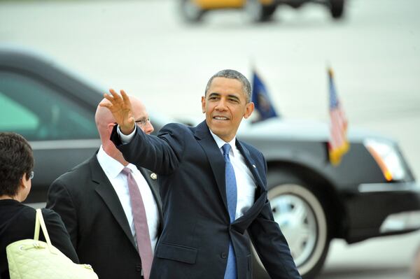 May 19, 2013 Atlanta - United States President Barack Obama leaves after he greeted members of a crowd gathered to greet him at Hartsfield-Jackson Atlanta International Airport on Sunday, May 19. President Obama visits Atlanta on Sunday to give a commencement speech at Morehouse and raise money for the Democratic Senatorial Campaign Committee at Arthur Blank's house. HYOSUB SHIN / HSHIN@AJC.COM President Obama, shown here in a 2013 visit to Atlanta, is facing resistance to his administration's stand on transgender students and school bathrooms. (AJC/Hyosub Shin)