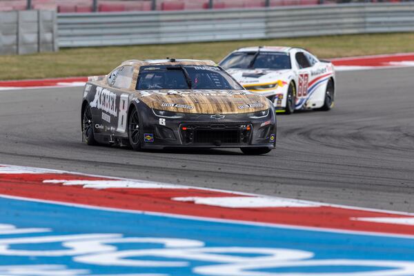 Kyle Busch, left, leads Shane van Gisbergen (88) through Turn 14 during a NASCAR Cup Series auto race at Circuit of the Americas in Austin, Texas, Sunday, March 2, 2025. (AP Photo/Stephen Spillman)