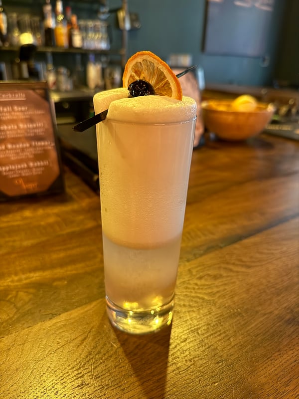 A zero-proof Slo Gin Fizz at Vesper Bar in Glenwood Park is made with ritual zero-proof gin, lemon juice, prickly pear, egg white (optional), soda water and lemon peel. Danielle Charbonneau/For the AJC