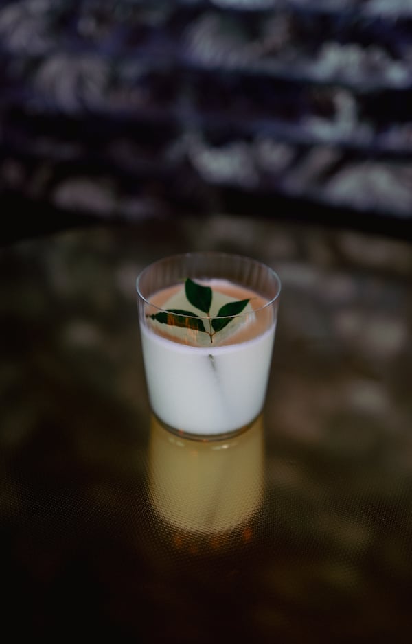 The Bites the Dust cocktail featuring soju, baijiu, lemon, coconut and a curry leaf will appear on the Lucky Star menu. (Courtesy of Ben Pham)