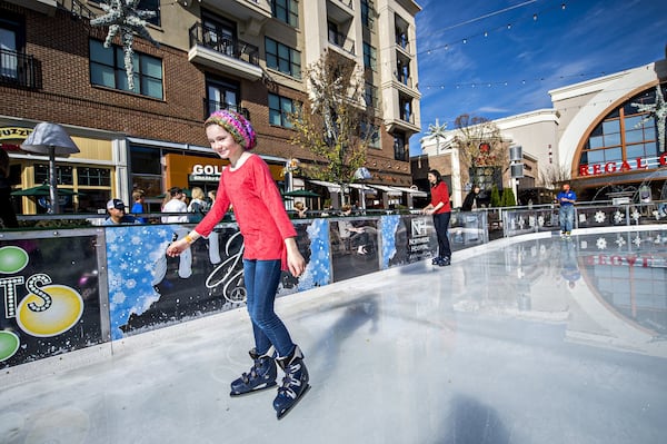 Avalon, the big Alpharetta mixed-use development, maintained regular hours and operations Friday. In this 2015 photo, skaters enjoyed the ice rink at Avalon. JONATHAN PHILLIPS / SPECIAL