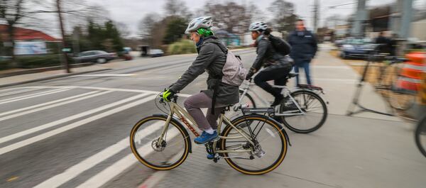 Bike riders enter the intersection at 10th and Monroe Drive from the Beltline. A new development has been proposed near the intersection. JOHN SPINK /JSPINK@AJC.COM AJC FILE PHOTO