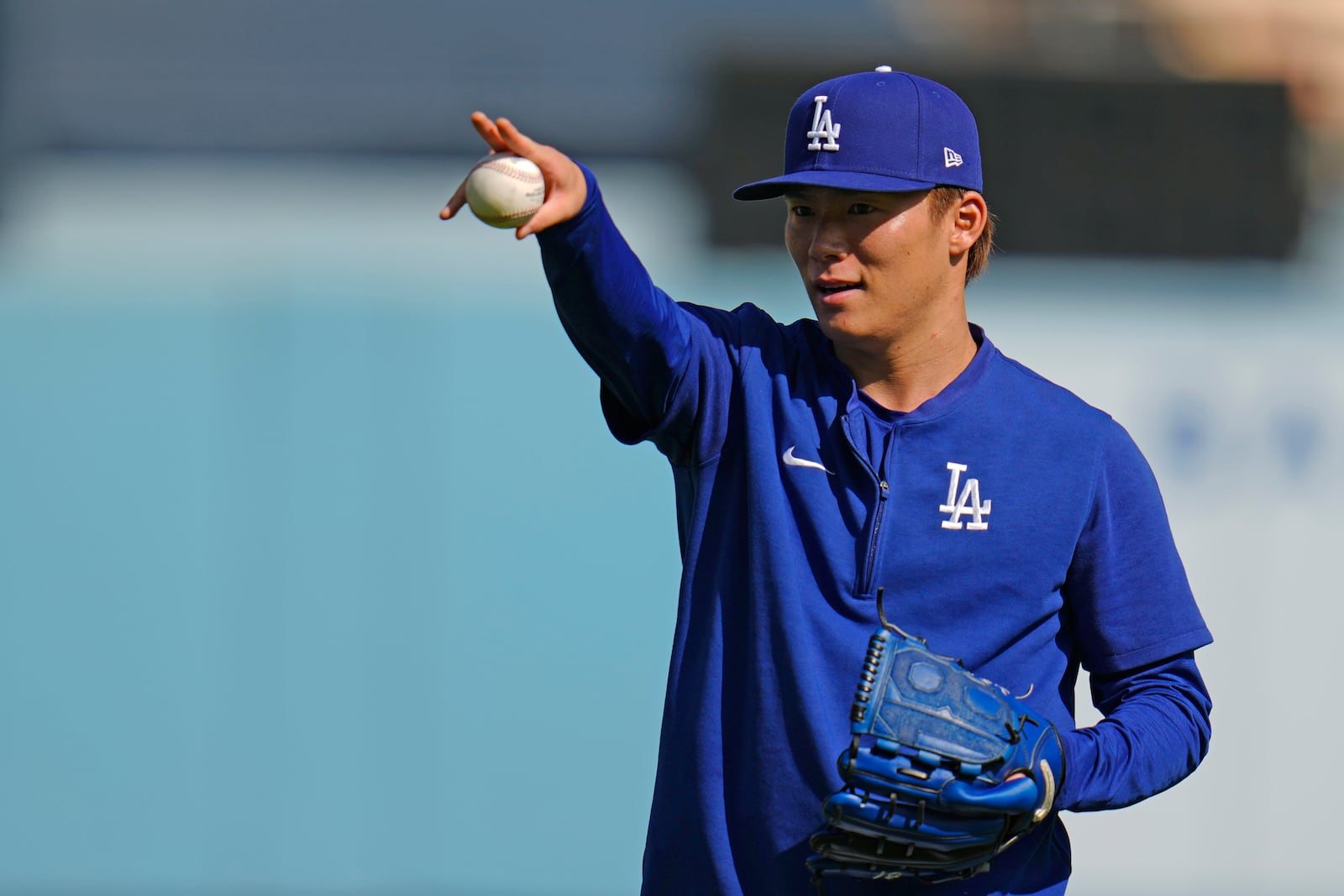 Los Angeles Dodgers pitcher Yoshinobu Yamamoto (18) throws during batting practice before Game 1 of the baseball World Series, Friday, Oct. 25, 2024, in Los Angeles. (AP Photo/Julio Cortez)