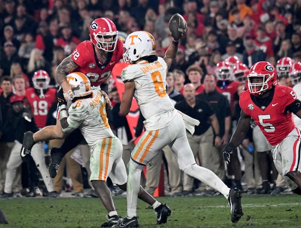 Tennessee quarterback Nico Iamaleava (8) throws a ball under pressure from Georgia linebacker Chaz Chambliss (32) during the second half in an NCAA football game at Sanford Stadium, Saturday, November 16, 2024, in Athens. Georgia won 31-17 over Tennessee. (Hyosub Shin / AJC)