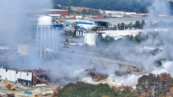 This aerial view, taken on the side of I-20, shows smoke traveling west from the Biolab facility in Conyers on Thursday, October 3, 2024. Atlanta Mayor Andre Dickens advised city residents to take precautions and reduce outdoor activities until noon on Thursday. He warned that smoke from a recently extinguished chemical plant fire in Rockdale County could drift westward.
(Miguel Martinez / AJC)