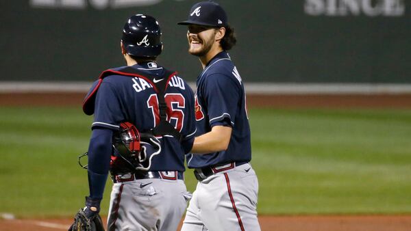 Braves starting pitcher Ian Anderson (48) smiles as he talks to catcher Travis d'Arnaud at the end of the fourth inning Tuesday, Sept. 1, 2020, in Boston. 