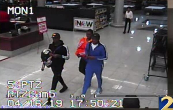 Police are searching for three men they say stole thousands worth of high-end camera equipment.