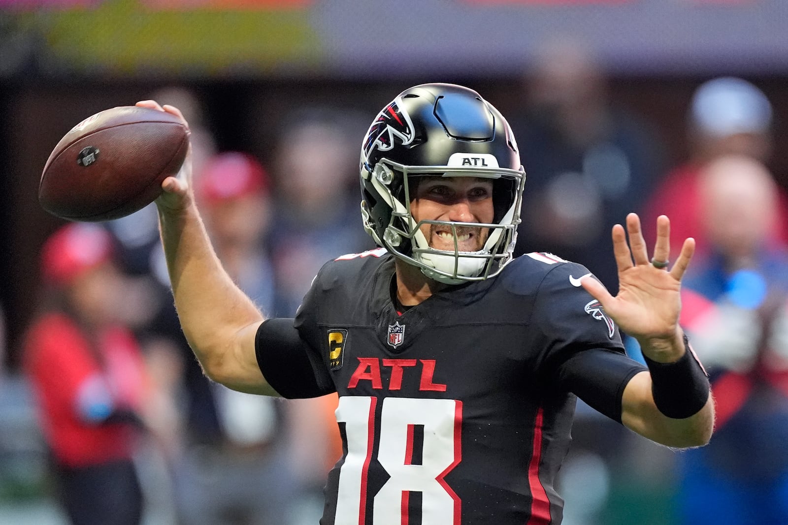 Atlanta Falcons quarterback Kirk Cousins (18) throws a pass during the first half of an NFL football game against the Seattle Seahawks, Sunday, Oct. 20, 2024, in Atlanta. (AP Photo/ Mike Stewart )