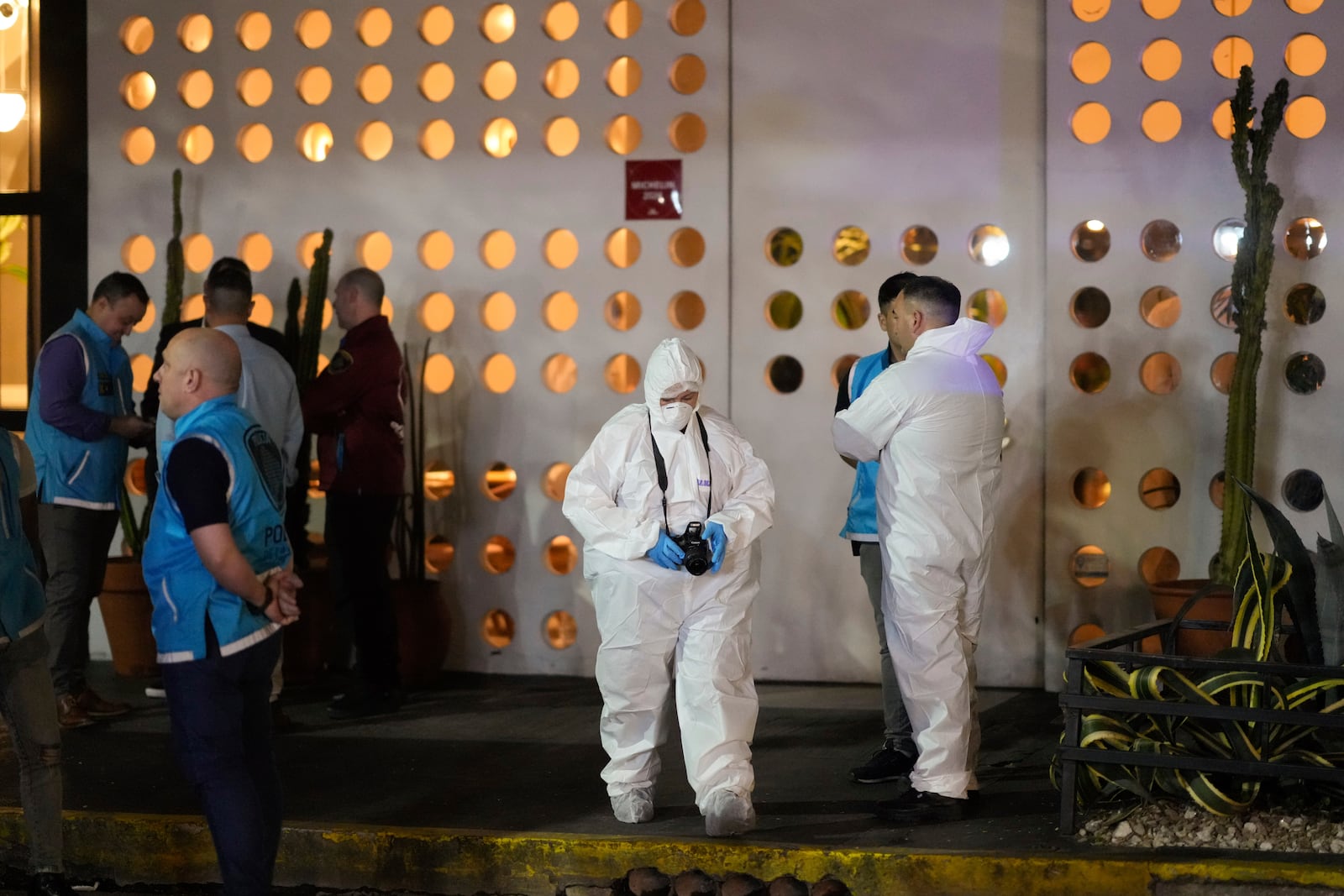 Forensic investigators exit the hotel where former One Direction singer Liam Payne, was found dead after falling from a balcony in Buenos Aires, Argentina, Wednesday, Oct. 16, 2024. (AP Photo/Natacha Pisarenko)