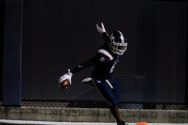 Marietta's Christian Mathis (6) scores a touchdown against McEachern Friday, Sept. 3, 2021, at Marietta's Northcutt Stadium.  (Jenn Finch/For the AJC)