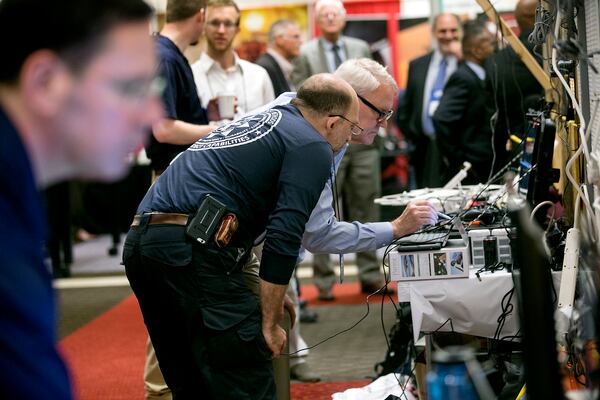 Technology: Texas A&M is hosting a drone summit in Austin on Wednesday and Thursday at the Rennaisnace Austin at the Arboretum.  A&M is creating what they say is the nation's first certification program for drone operators, and the first company getting certified is Austin-based HuvrData. Kamel Saidi, left (with the National Institute of Standards and Technology or NIST) and Mark Paulson work at a ground control station, trying to set up a drone for NIST. 
 LAURA SKELDING/AMERICAN-STATESMAN