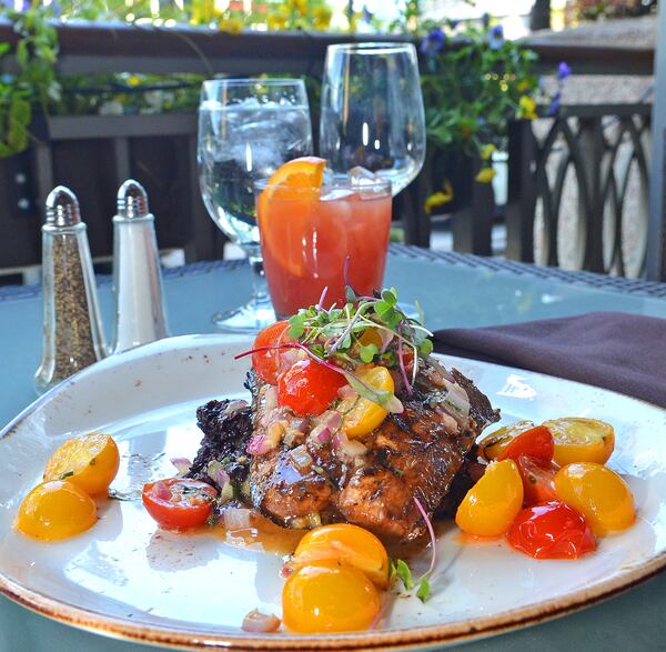  Chef Tonya Morris prepares and grills fresh grilled cobia, with black rice and sauteed tomatoes. (Chris Hunt/Special)