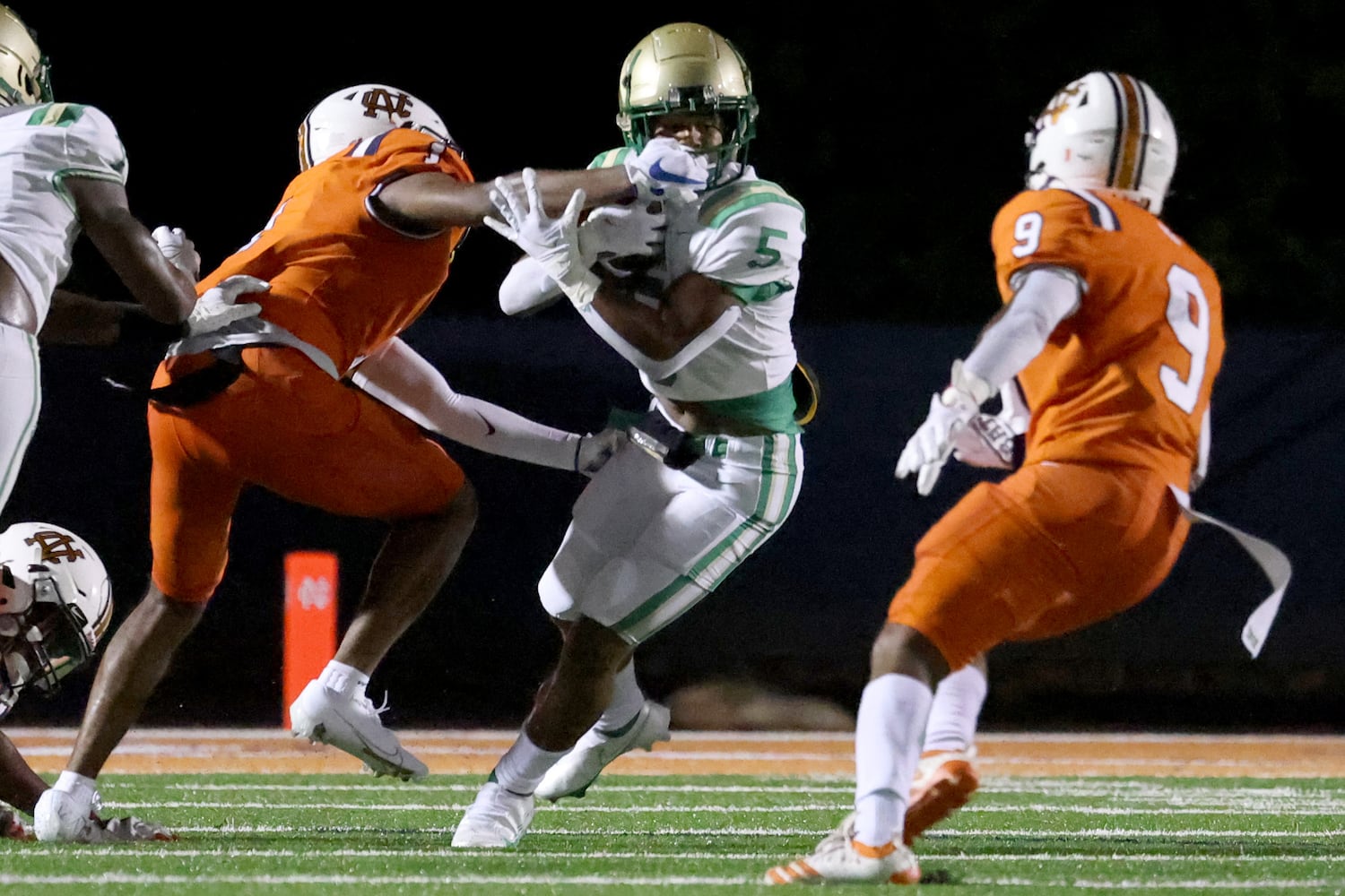 August 20, 2021 - Kennesaw, Ga: North Cobb defensive back Andre Stewart (1) is called for a face mask penalty on Buford running back CJ Clinkscales (5) during the first half at North Cobb high school Friday, August 20, 2021 in Kennesaw, Ga.. JASON GETZ FOR THE ATLANTA JOURNAL-CONSTITUTION