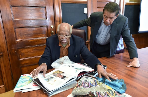 Prominent alumni Leo Twiggs, left, and Cecil Williams look some of their works at Claflin University. Twiggs, an artist and 1956 graduate of Claflin, and the school's Distinguished Artist-in-Residence. (HYOSUB SHIN / HSHIN@AJC.COM)