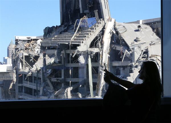 Atlanta: Falcons fan Melanie Inabinet makes a video of the remains of the Georgia Dome from inside Mercedes-Benz stadium. The Georgia Dome was imploded last year.  Curtis Compton/ccompton@ajc.com