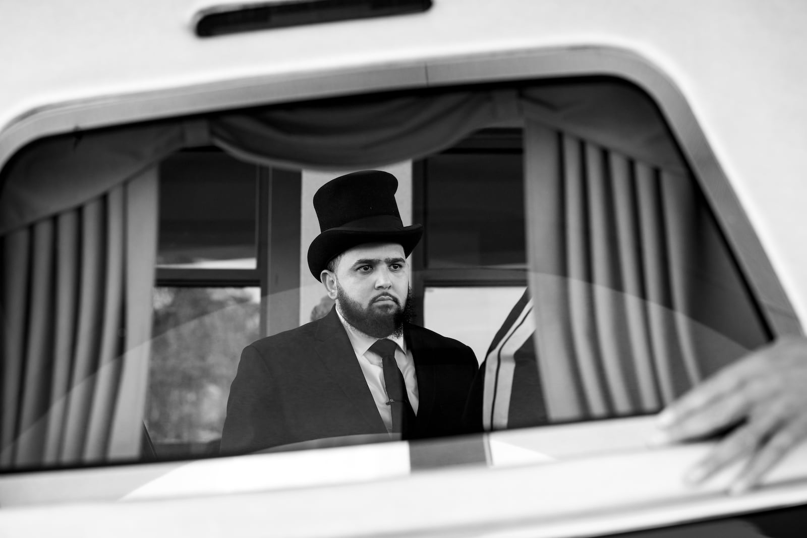 Funeral attendant Preston Hall is seen at the funeral of Julian Reeder at Fountain of Faith Missionary Baptist Church in Riverdale.