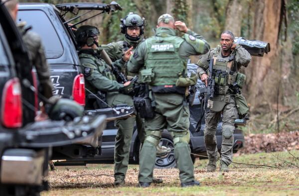 Georgia state troopers helping conduct a "clearing operation" at the site of Atlanta's planned public safety training center on Jan. 18, 2023, exchanged gunfire with a protester, leaving the protester dead and one trooper wounded. (John Spink / John.Spink@ajc.com)

