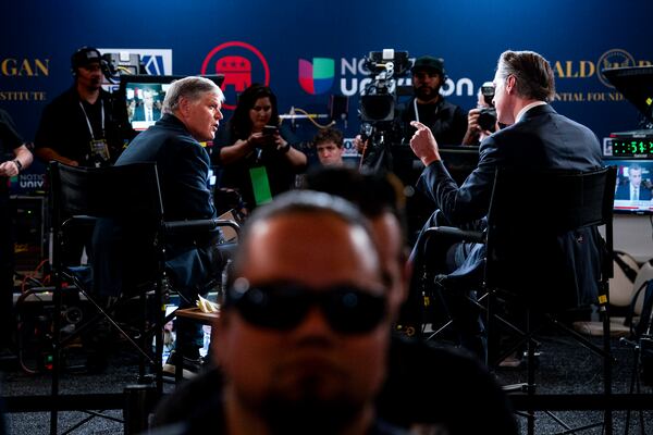 Fox News' Sean Hannity, left, interviews California Democratic Gov. Gavin Newsom following the second Republican primary debate in September in Simi Valley, Calif. The two will be part of another program Thursday when Newsom debates Florida Gov. Ron DeSantis and Hannity serves as moderator. (Haiyun Jiang/The New York Times)
                      