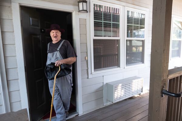 Stefan Emerson, a longtime resident at the Rosalynn Apartments in Chamblee, leaves his apartment to take his mother shopping Monday, July 24, 2023. (Ben Gray / Ben@BenGray.com)