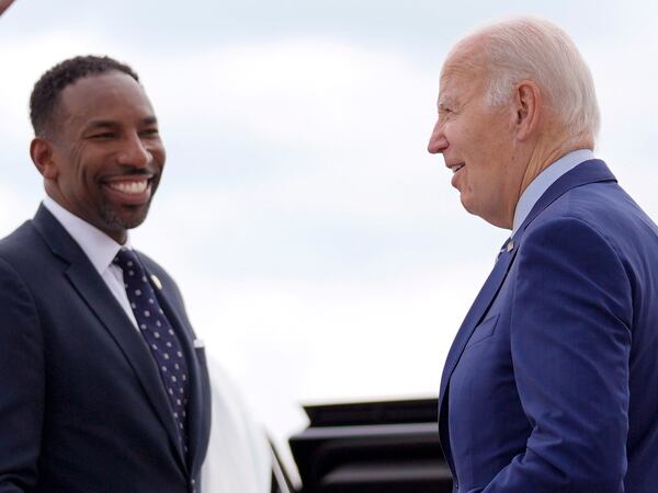 Atlanta Mayor Andre Dickens, left, greets President Joe Biden as Biden arrives at Dobbins Air Reserve Base, Thursday, June 27, 2024, in Marietta, Ga., en route to Atlanta to attend the presidential debate. (AP Photo/Evan Vucci)