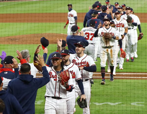 The Atlanta Braves celebrate clinching their third consecutive National League East championship title with a 11-1 victory over the Miami Marlins in a MLB baseball game on Tuesday, Sept. 22, 2020 in Atlanta.   “Curtis Compton / Curtis.Compton@ajc.com”