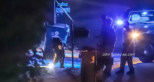 South Fulton police investigators work to collect evidence at the scene of a deadly shooting on Mastiff Road on Wednesday morning. 