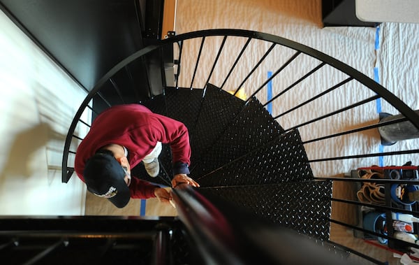 Mauro Rios at one of condo units at the Fulton Cotton Mill in Cabbagetown. HYOSUB SHIN / hshin@ajc.com